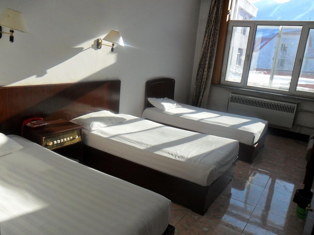 Yabuli Xintong Hotel Shangzhi Rum bild